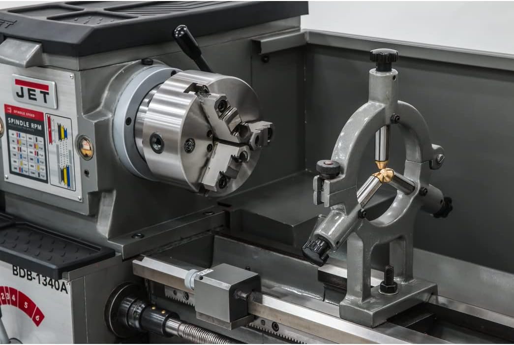 Close-up of the lathe's chuck and steady rest, demonstrating how a workpiece would be supported.