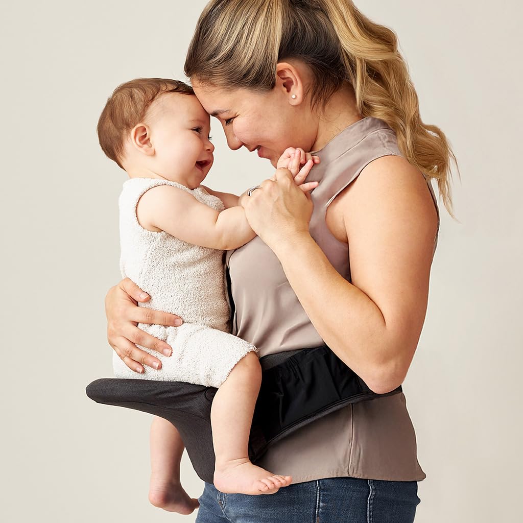 Itzy Ritzy Hip Seat Baby Carrier – Foldable 3-Position Infant & Toddler Carrier, Supports 12–44 lbs, Strapless, Lightweight Design – Includes Zippered Pocket & Extender to Fit Waists up to 62" (Black)