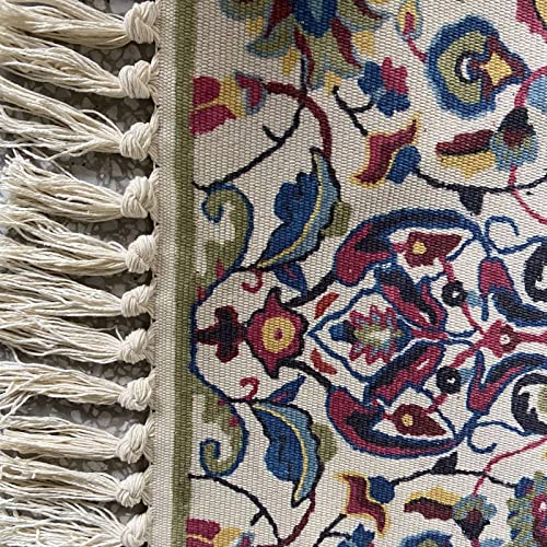 Tapis en coton de qualité supérieure orné de délicats pompons