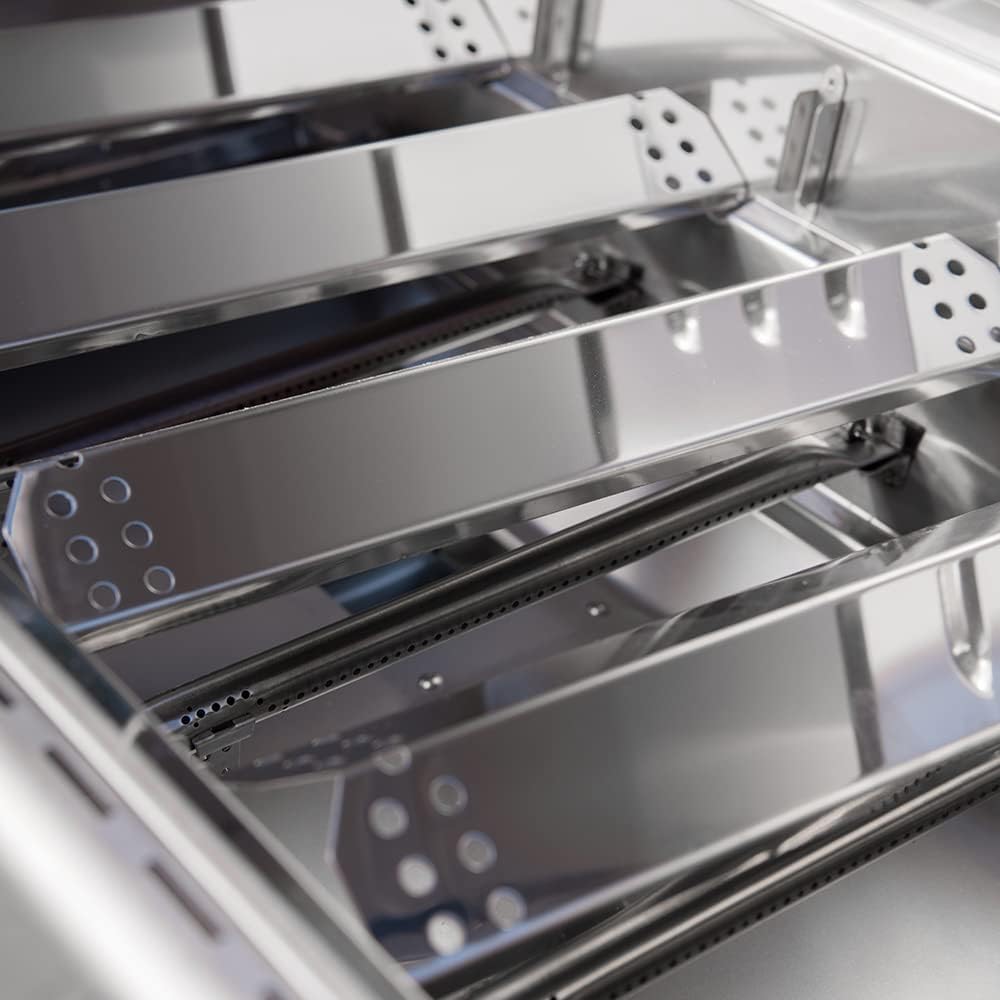 Interior view of the grill with stainless steel heat plates and cooking grids.