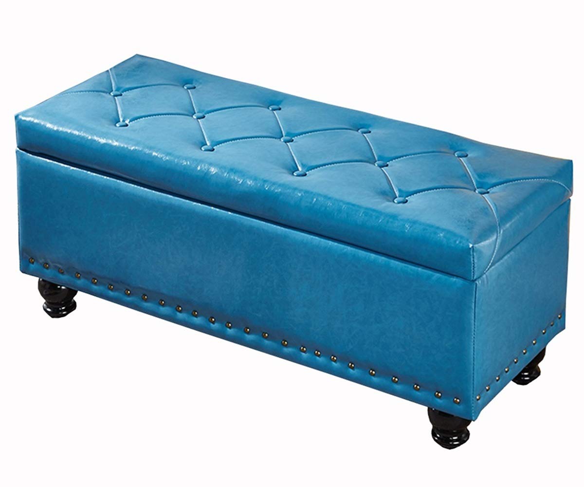 Ottoman bleu repose-pieds capitonné pour un salon ordonné et accueillant