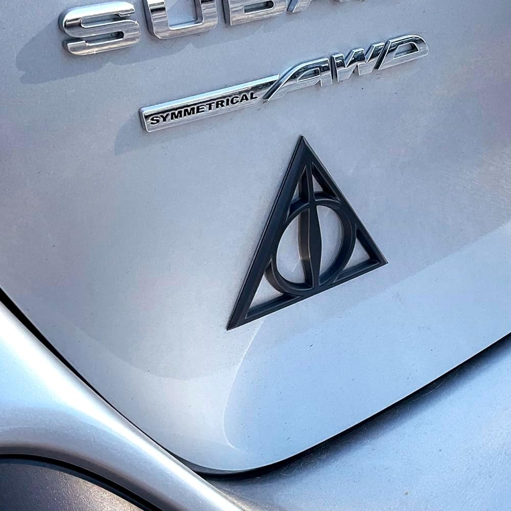 Fan Emblems Deathly Hallows Car Emblem - Harry Potter Symbol 3D Auto Badge - Color: Matte Black - Size: 3.7 x 3.2 x 0.2 inches - Officially Licensed Wizarding World Car Accessories