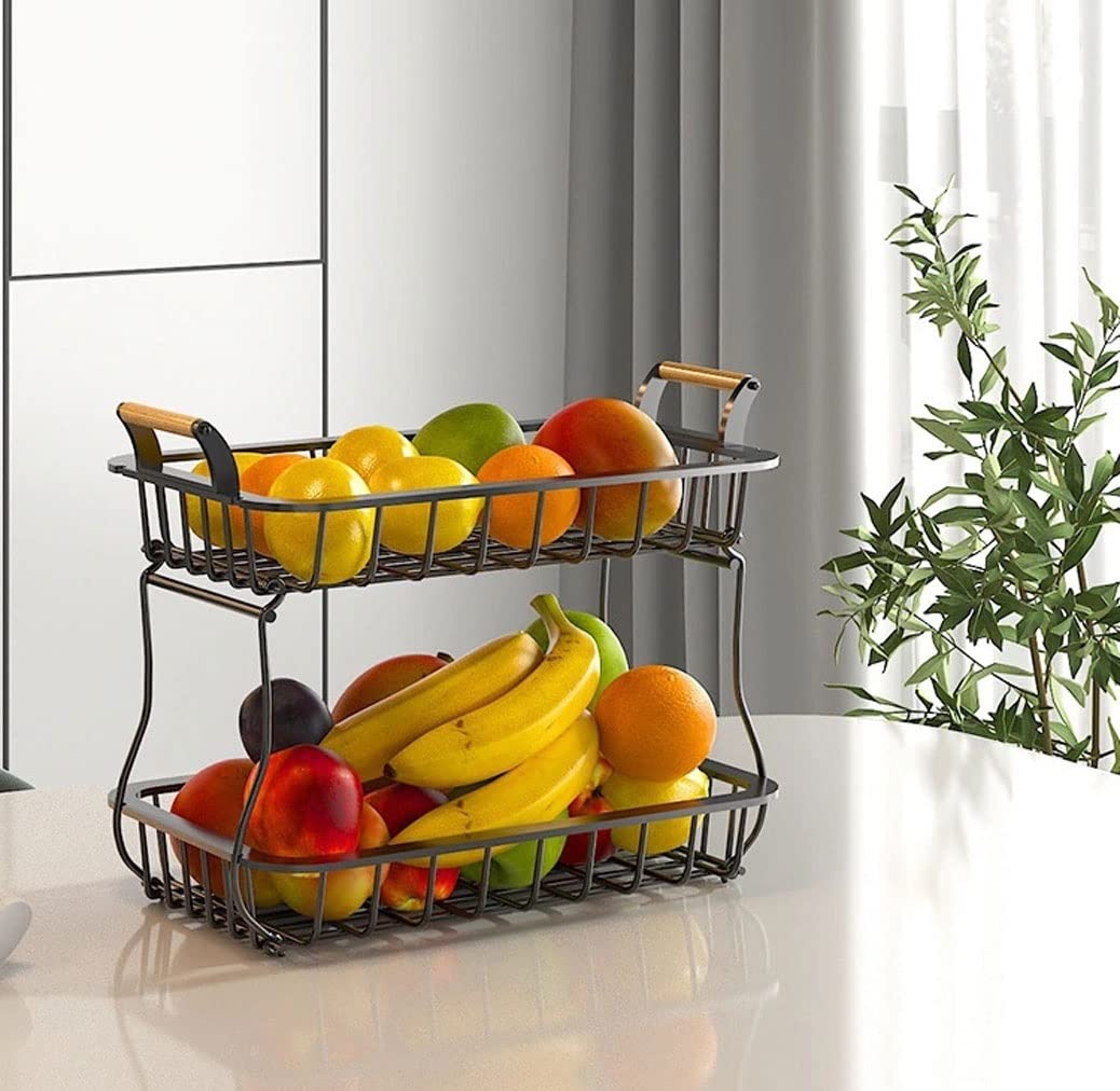 Grote fruitmand met twee lagen voor op het aanrecht, inclusief twee