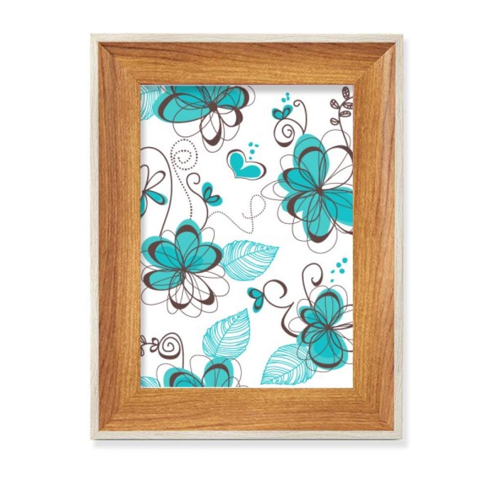 Cadre photo en bois et fleurs de style art moderne pour embellir un bureau
