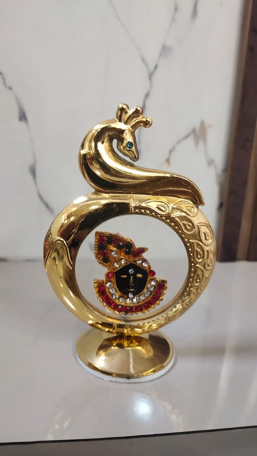 Pooja crafty hands shree nath Ji Decorative Gold-Plated Peacock Design Stand with Crystal-Studded Religious Deity Motif, Traditional Indian Style