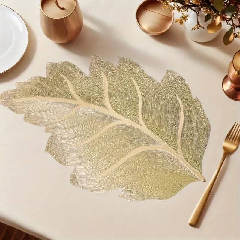 Image of Dakshya Industries Set of 2 PVC Waterproof Leaf Design Table Placemats | Premium Gold Finish Dining Table Mats | Heat Resistant, Washable & Anti-Slip | Decorative Kitchen & Dining Mats (Gold)