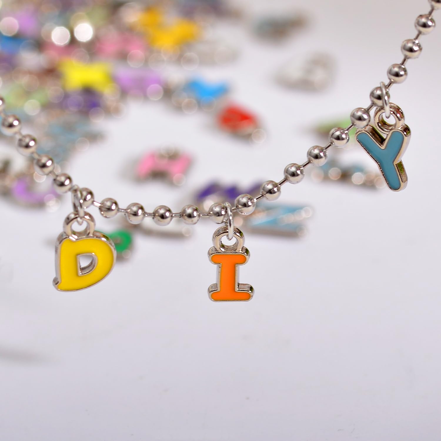 stino 200Pcs A-Z Metal Letter Charms for Jewelry Making, Capital Alphabet Initial Charms for Bracelet Earrings Craft (200Pcs Random Silver Cursive)