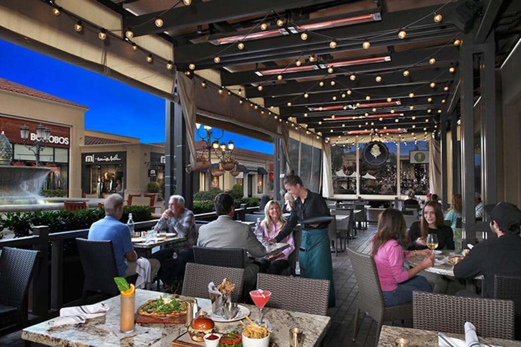 Outdoor patio with multiple Infratech heaters providing warmth