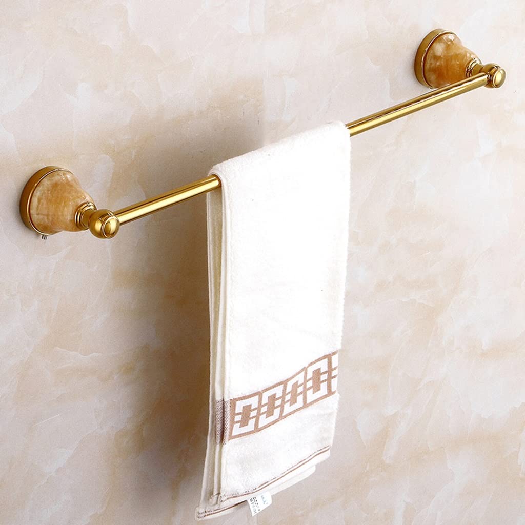 Porte-serviettes doré contre le désordre : la solution en cuivre pour salle de bain propre