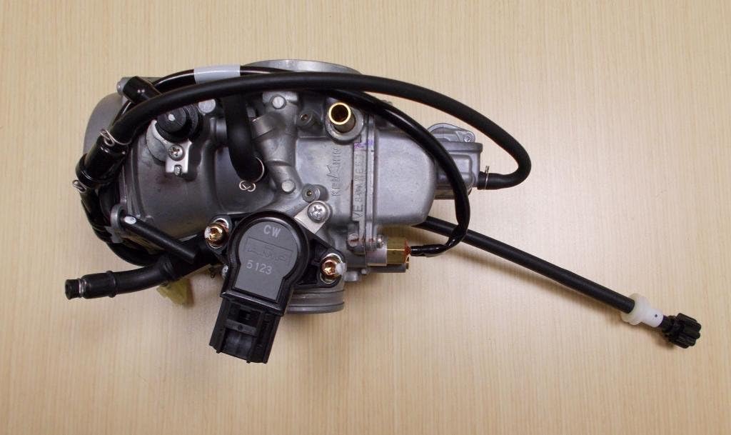 Bottom view of the Honda TRX 650 Rincon carburetor, showing the float bowl and electrical connector.
