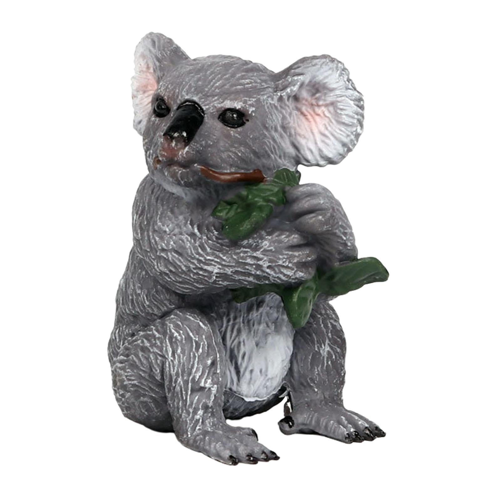 Figurine koala pour jardin et balcon : l'accessoire photo idéal parmi les feuilles