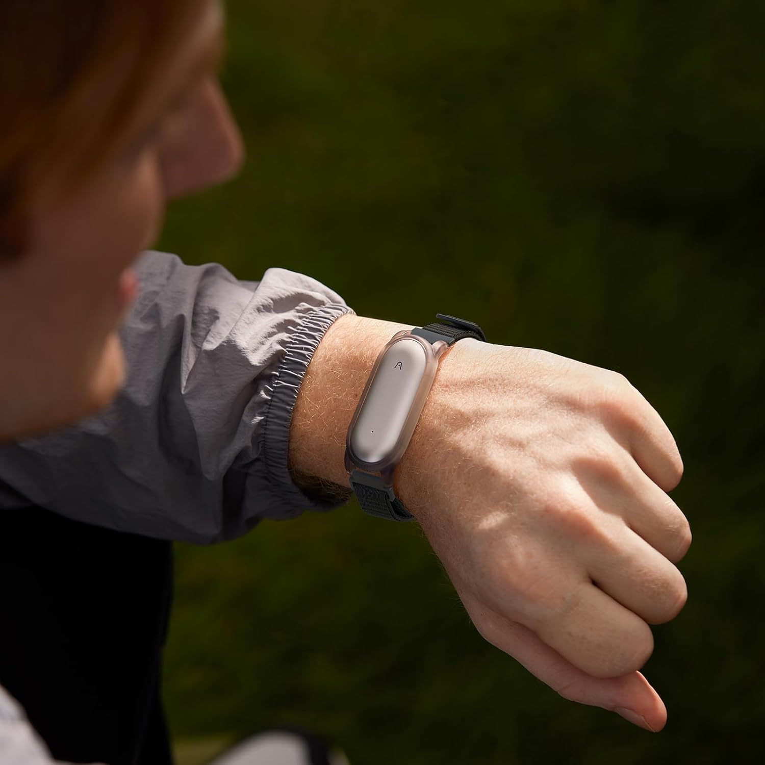 Person wearing the Plaud NotePin Wristband on their wrist