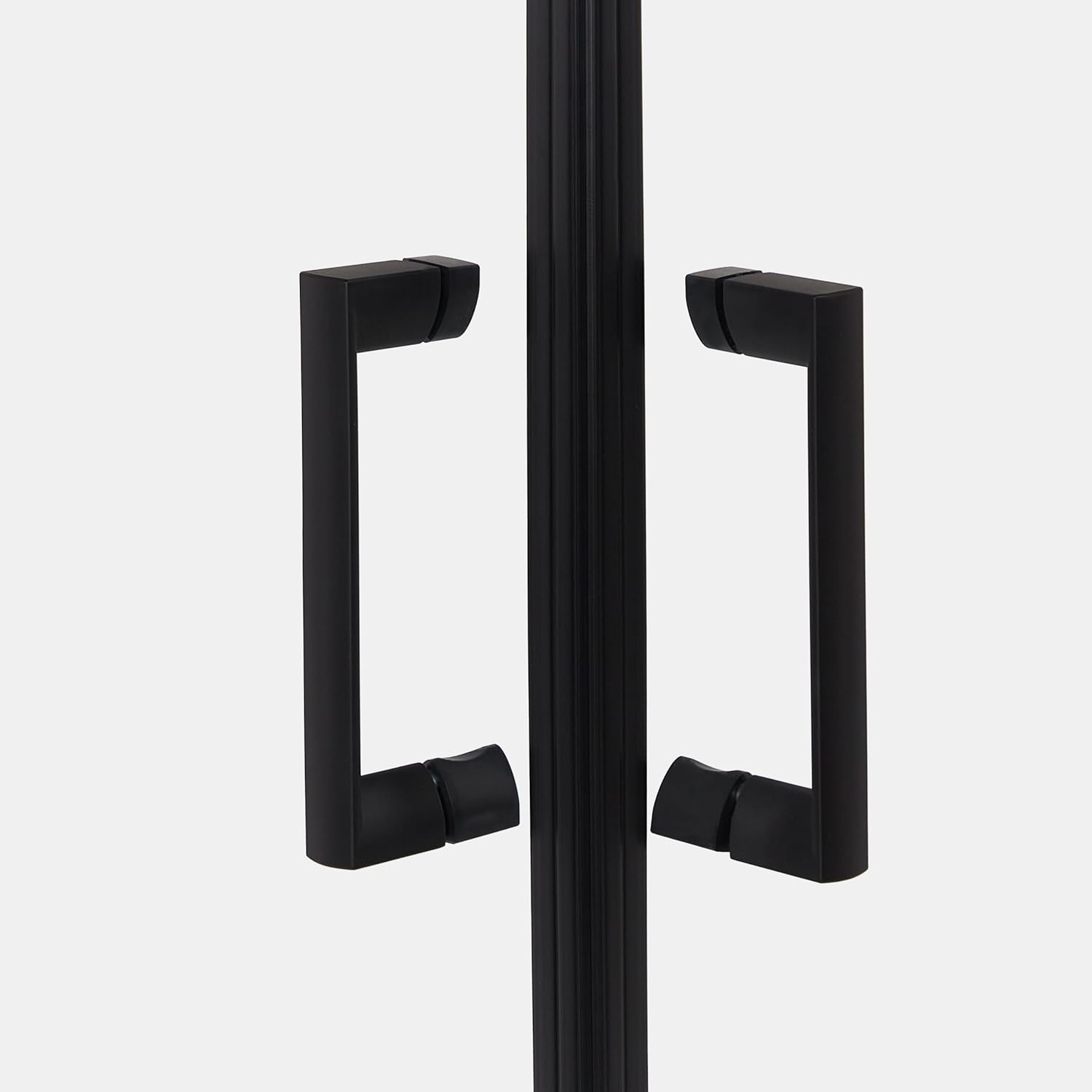 Close-up of the black square handles on the sliding doors of the shower cabin.