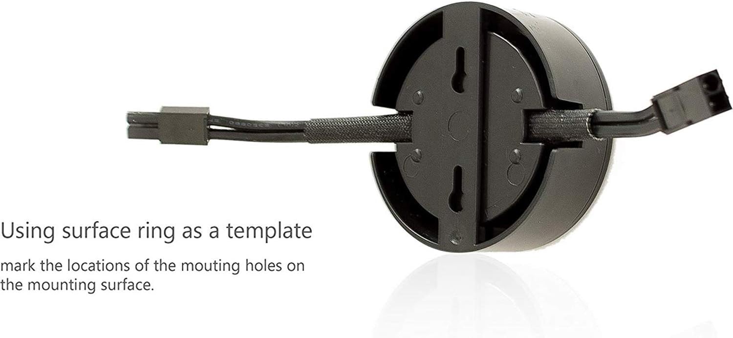 Back of a Utilitech LED Puck Light showing mounting holes and a caption 'Using surface ring as a template mark the locations of the mounting holes on the mounting surface.'