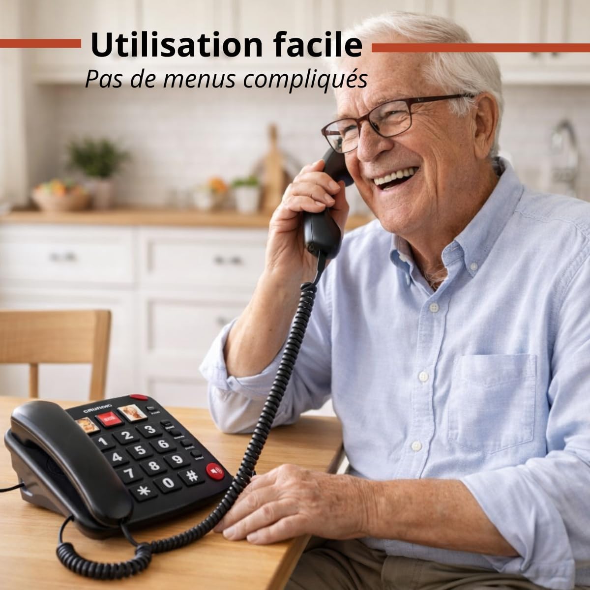 Senior man happily using the Grundig Senior Fixed Telephone