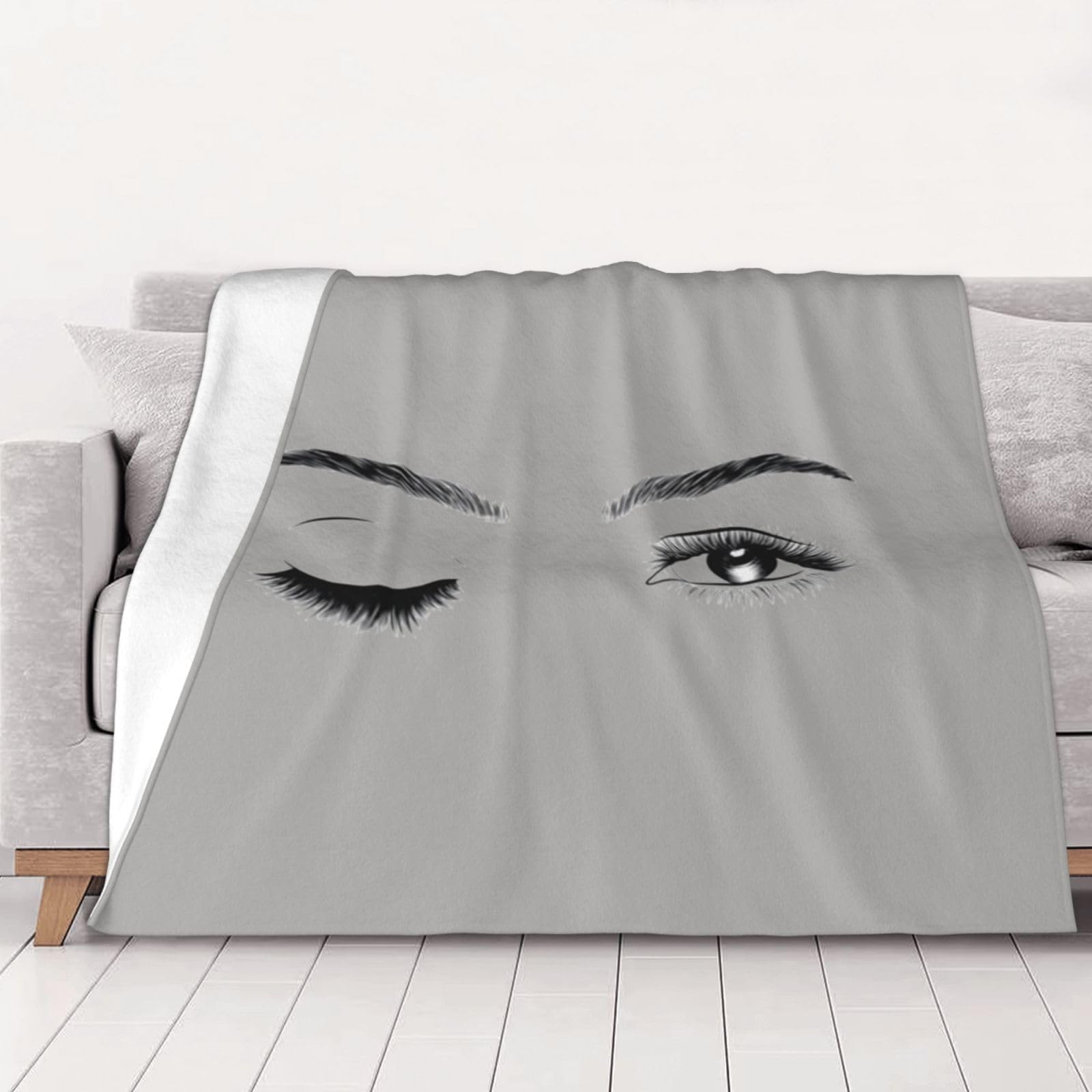 Couverture flanelle imprimée cils un cocon de douceur pour des moments de tendresse