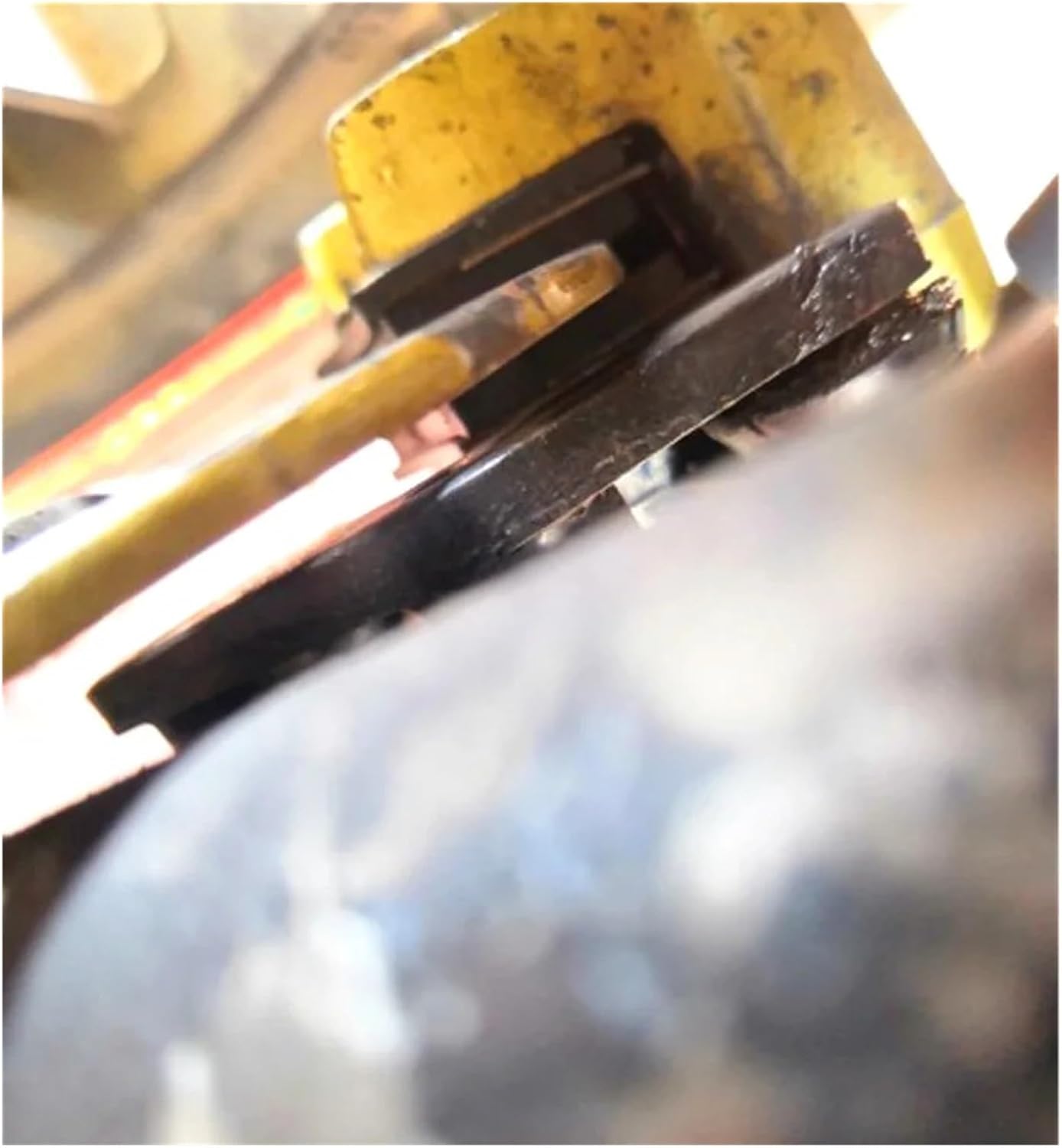 Close-up view of a brake pad installed within a disc brake caliper.