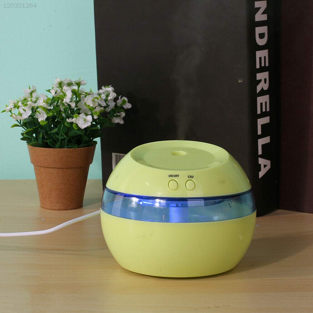 IVELECT E97A Diffuser placed on a wooden surface next to a potted plant