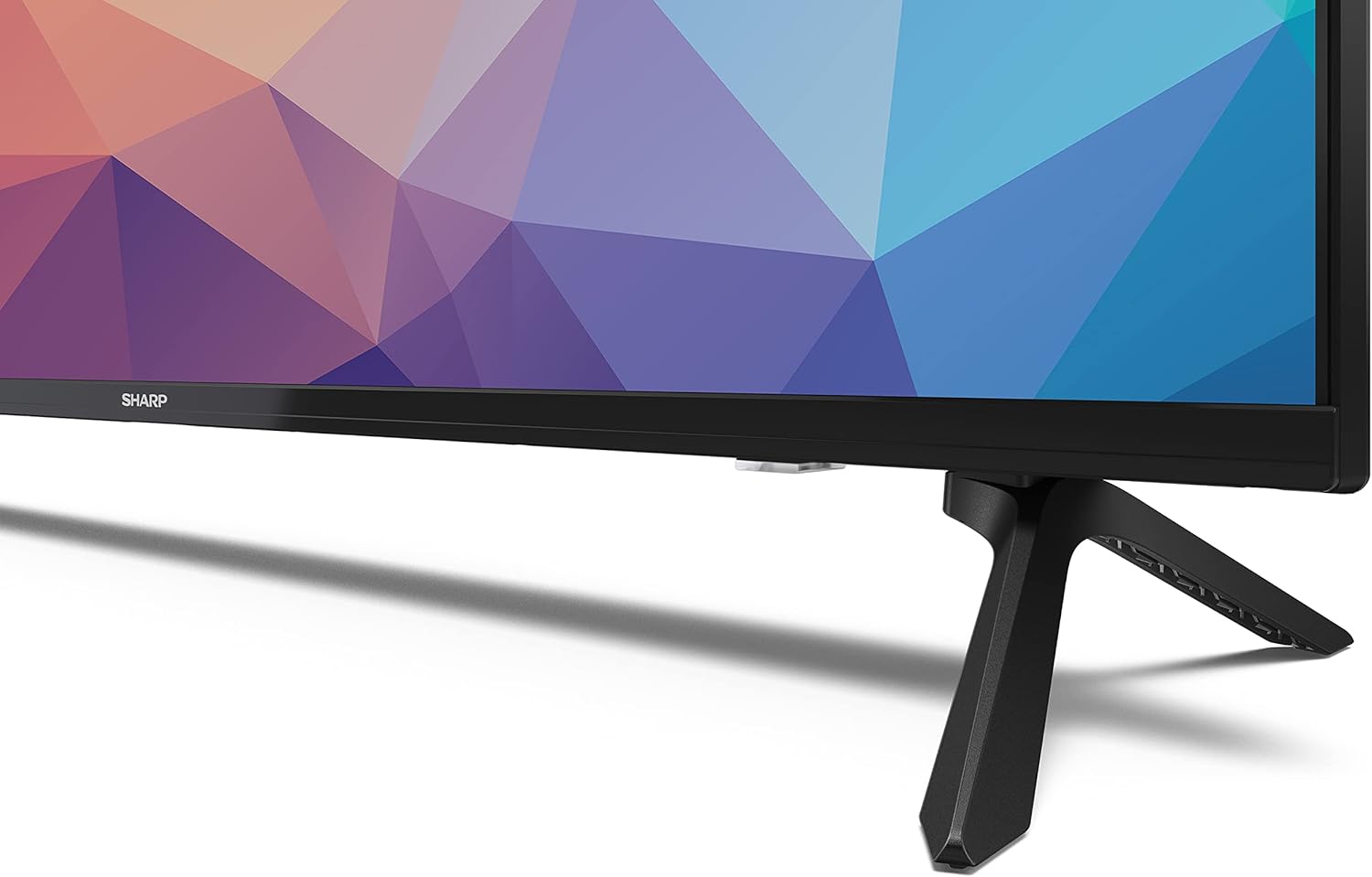 Latalata view of the TV stand attached to the bottom of the Sharp Aquos TV.