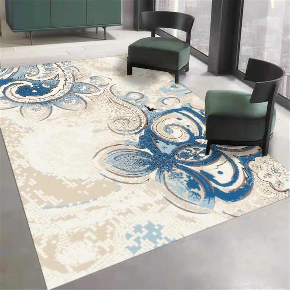 Tapis lavable bleu et durable avec motif floral abstrait