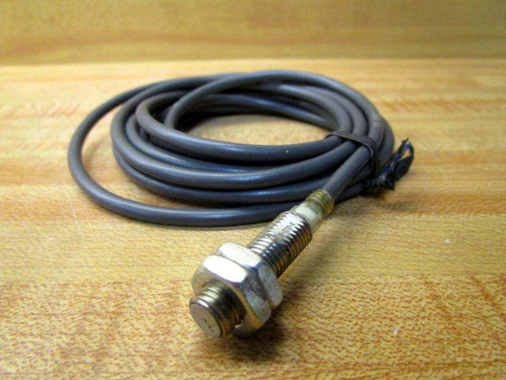 Close-up of the Omron E2E-X2D2-N sensor head and coiled cable