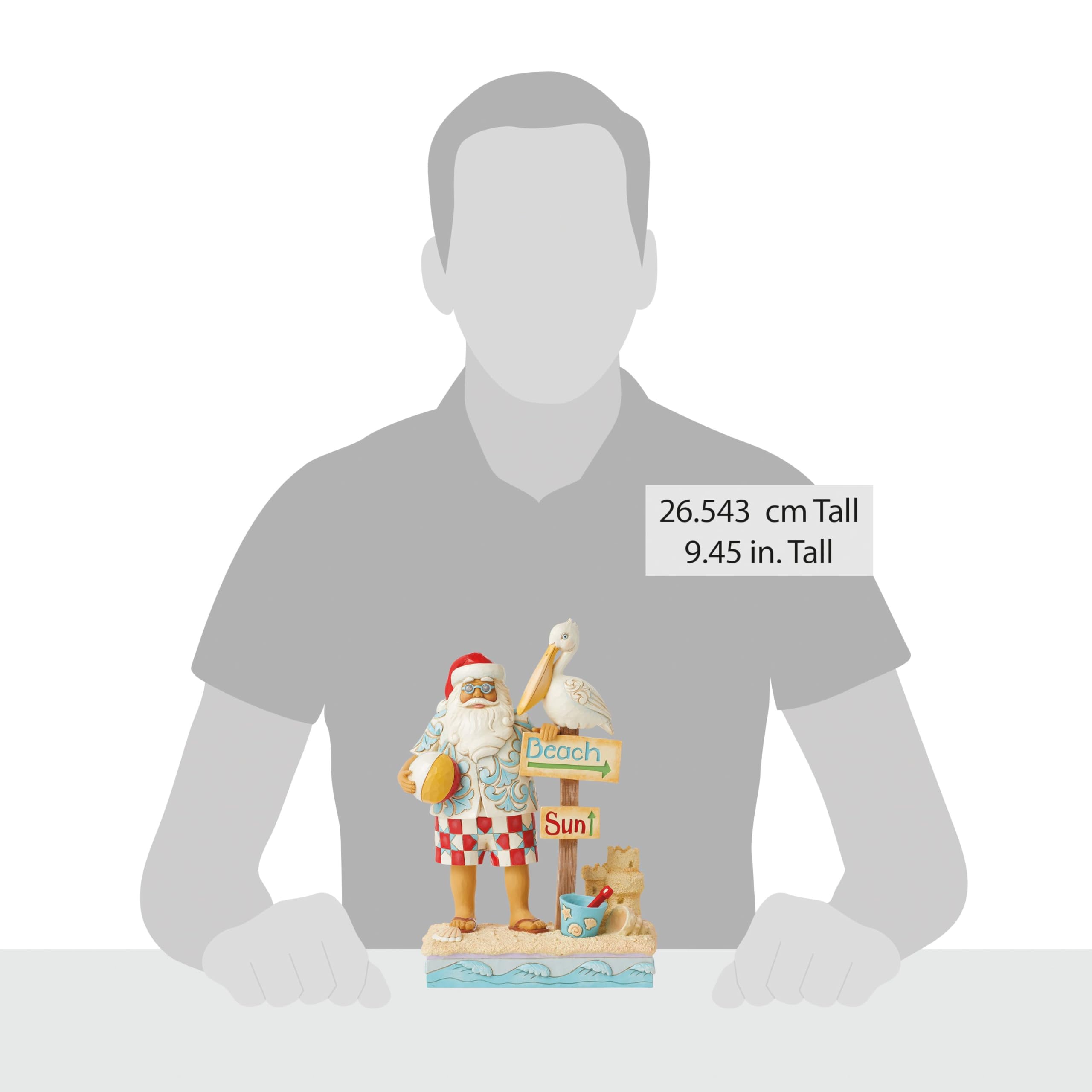 Enesco Jim Shore Heartwood Creek Figurine de Père Noël côtier avec panneaux de plage et pélican - Pierre en résine peinte à la main - Figurine de Père Noël de collection - Décoration d'intérieur - 24