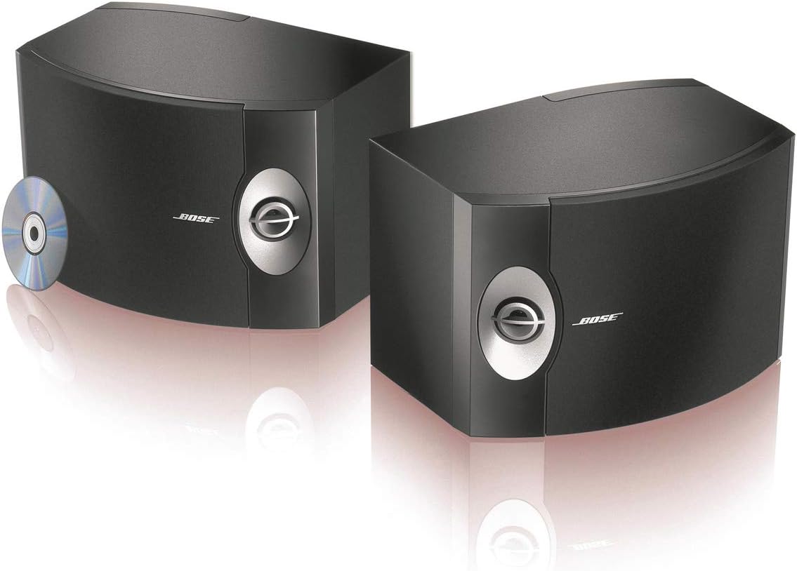 Pair of Bose 301-V Stereo Loudspeakers in black finish, shown from the front with a CD disc next to them.