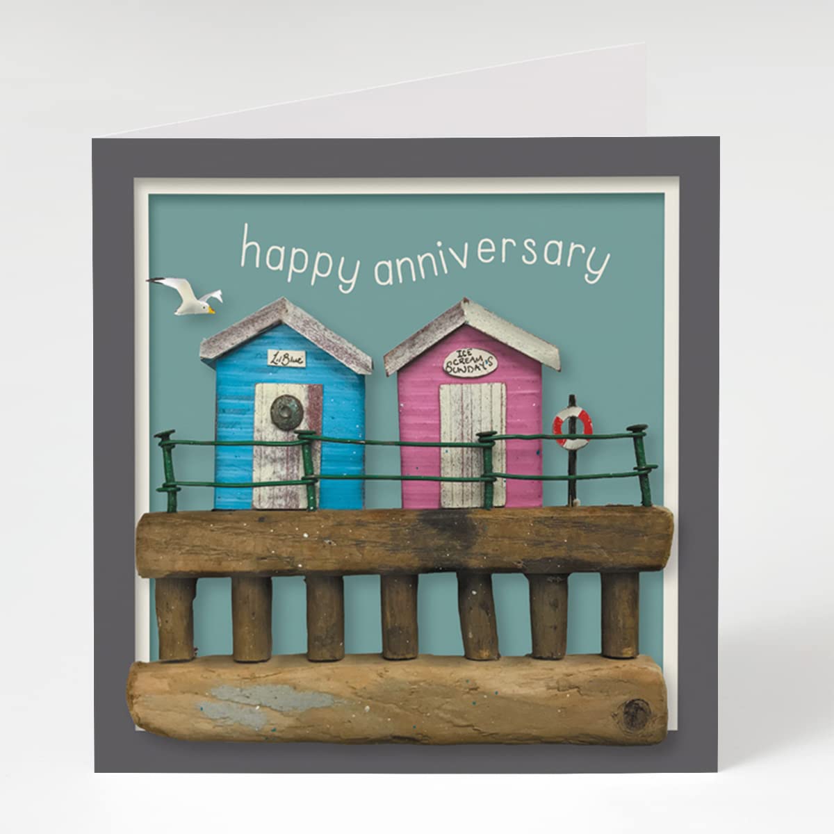 "Anniversary Beach Huts" Blank Coastal Themed Wedding Anniversary Card Designed by Seth Draper for Holy Mackerel, 150mm Square with a Brown Kraft Envelope