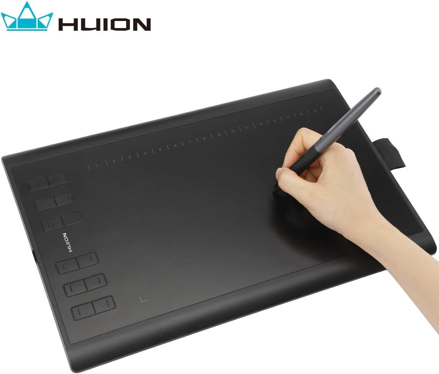 HUION graphics tablet connected to a laptop with the stylus resting on it.