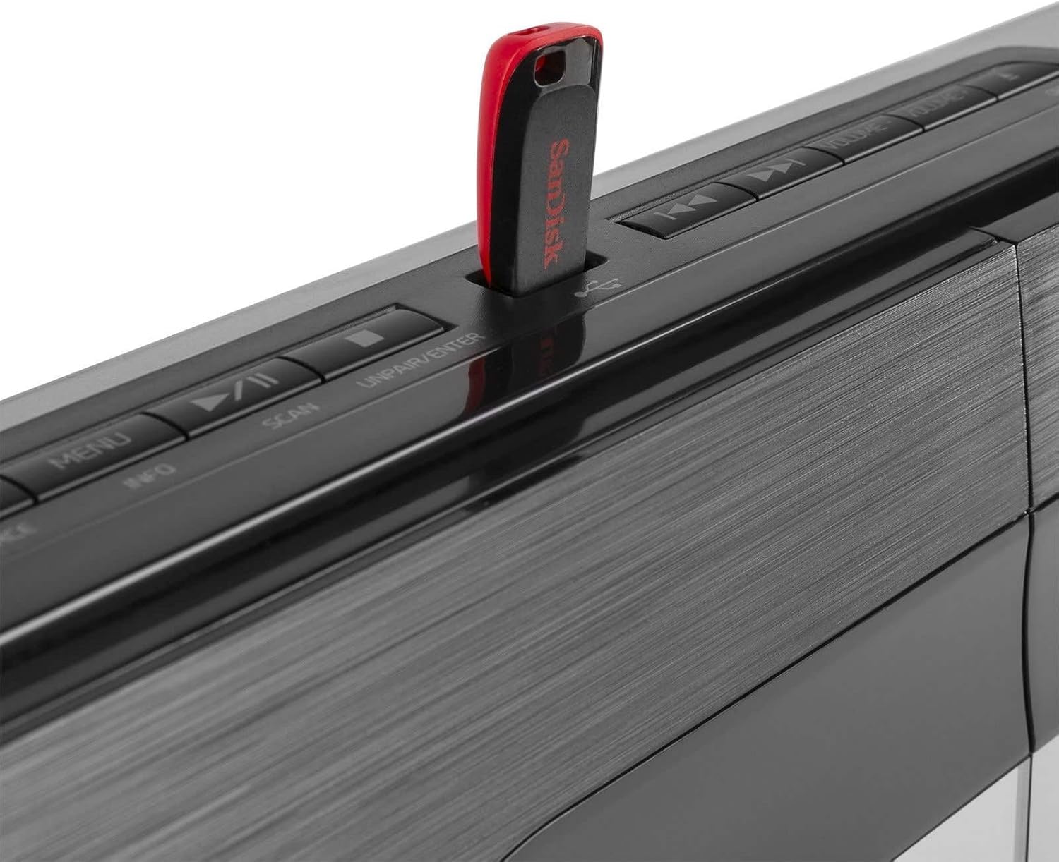 Close-up of the Audizio Tours USB port with a red USB flash drive inserted