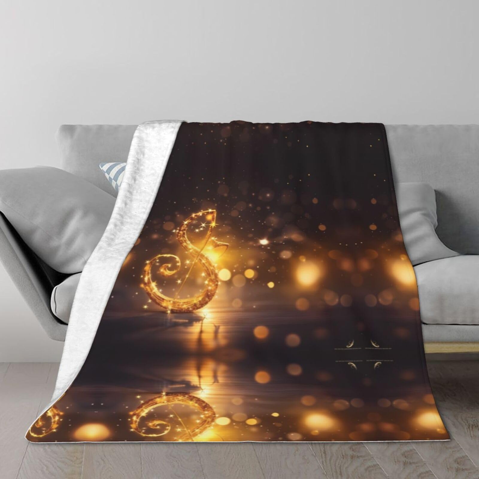 Couverture peluche musique dorée douce pour soirées canapé et voyages