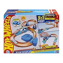 Hot Wheels – Boosted Jump Speedway, set pista con box deluxe da costruire e booster motorizzato, macchinina in scala 1:64 inclusa, giocattolo per bambini, 5+ anni, JDB49