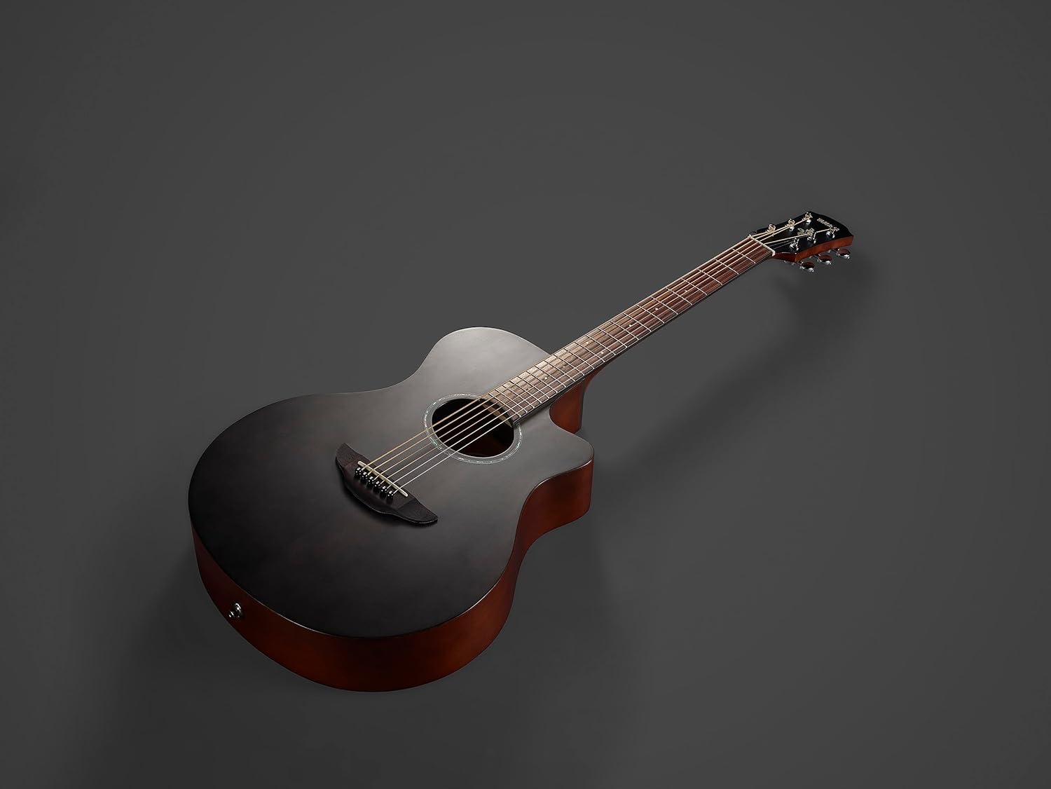 Yamaha APX600M Thin Body Acoustic-Electric Guitar, close-up of the headstock with Yamaha logo and tuning pegs.