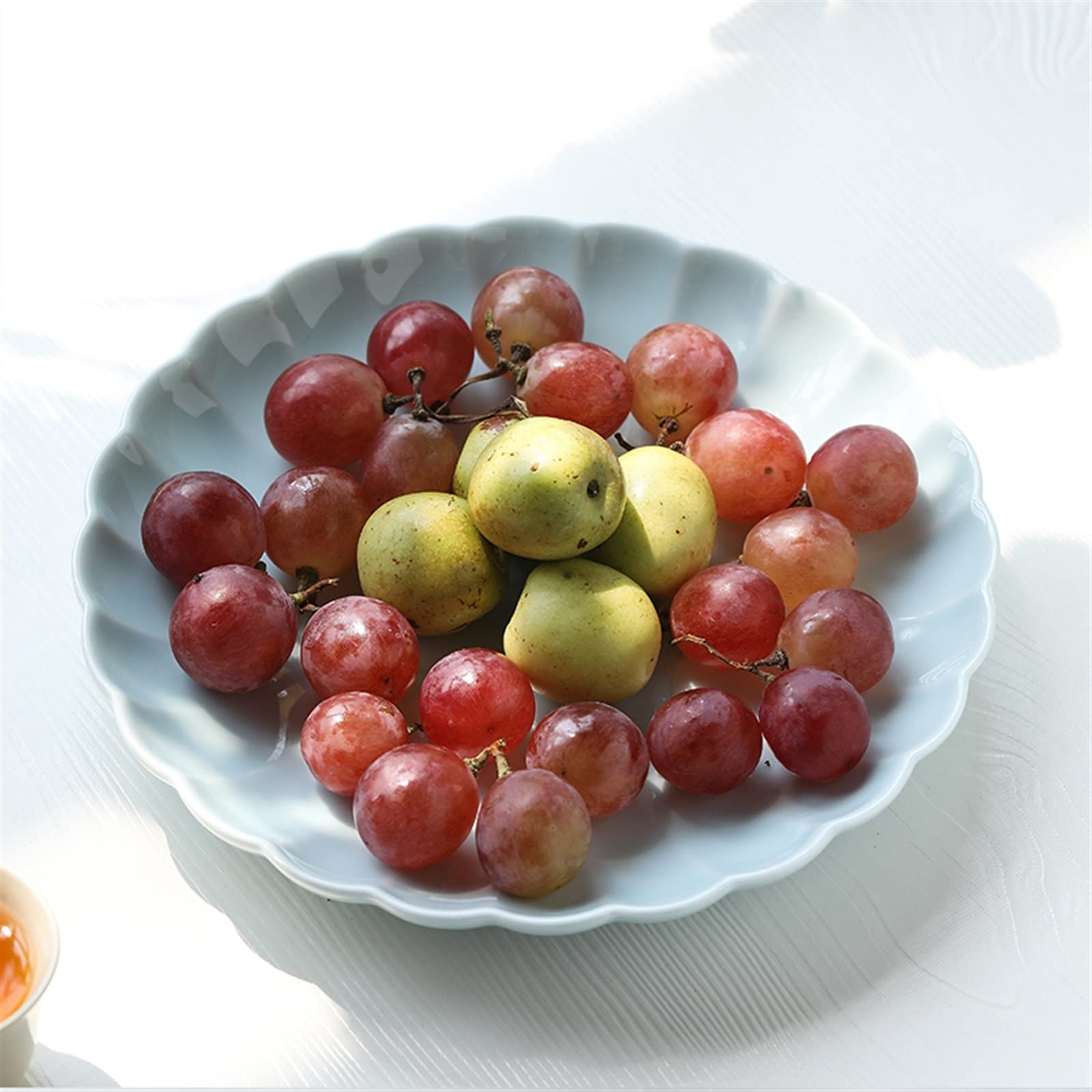 Ciotole di frutta Piatto da frutta Celadon Ciotola da dessert in ceramica Snack domestico Piatto da caramelle Vassoio for alimenti a forma di petalo dal design semplice Piatto di frutta decorativo