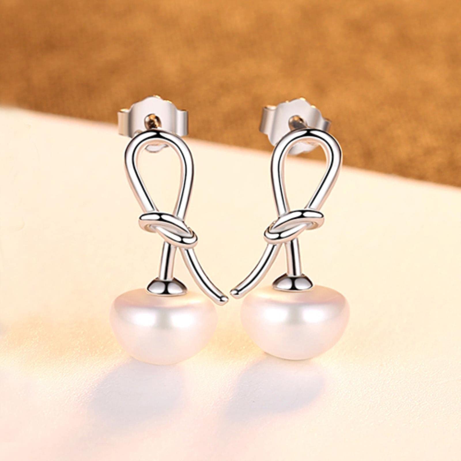 Boucles d'oreilles nœud papillon argent 925 anti-allergie avec perles naturelles délicates
