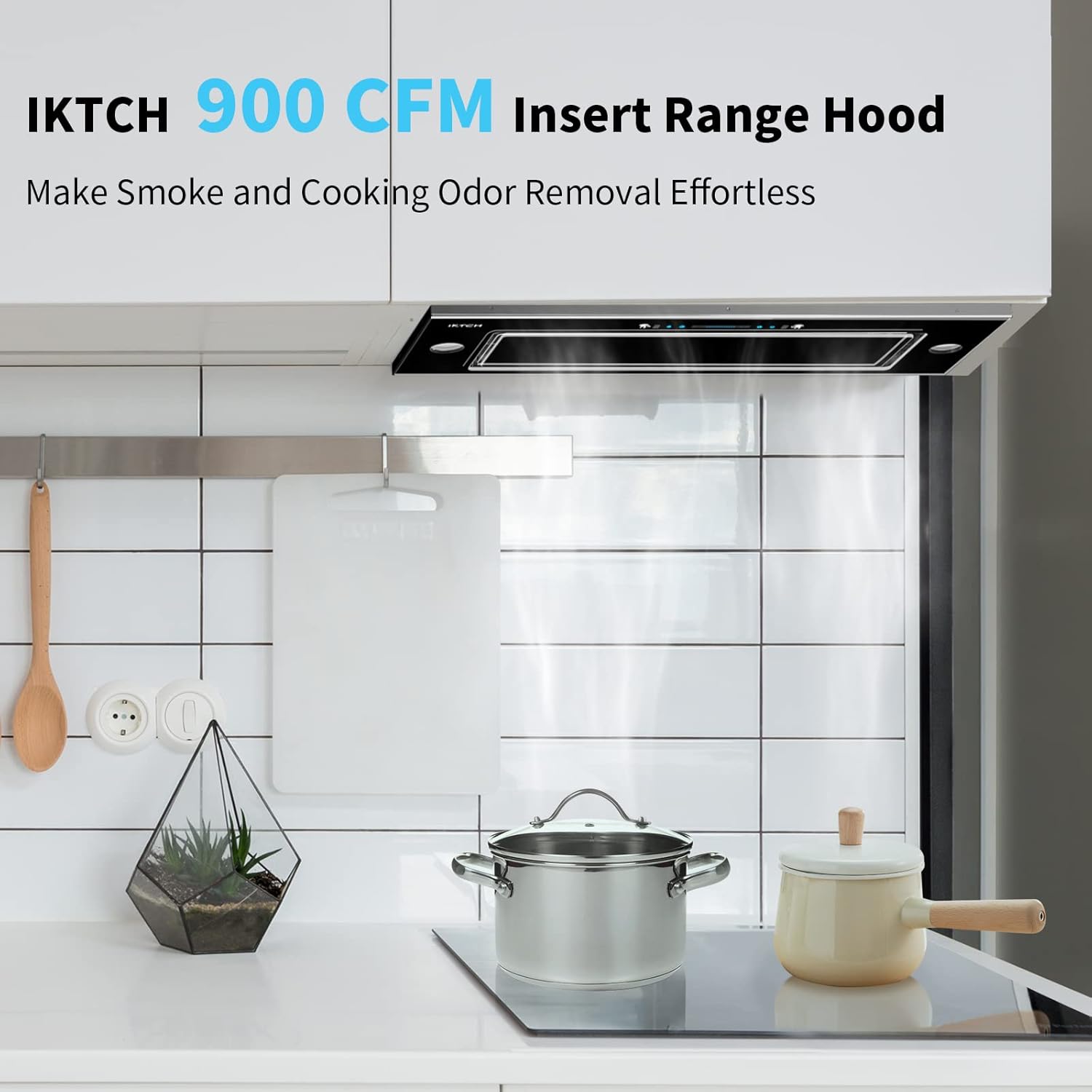 IKTCH 900 CFM insert range hood installed above a stovetop in a modern kitchen.