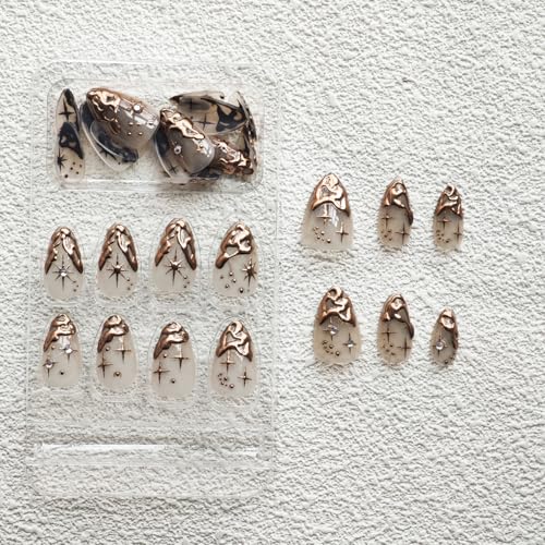 Image of Gold Press on Nails Short Almond Fake Nails French Tip False Nail With 3D Gold Irregularity Chrome Design Nude Glue on Nails Glossy Acrylic Full Cover Star Moon Stick on Nail for Women 24Pcs