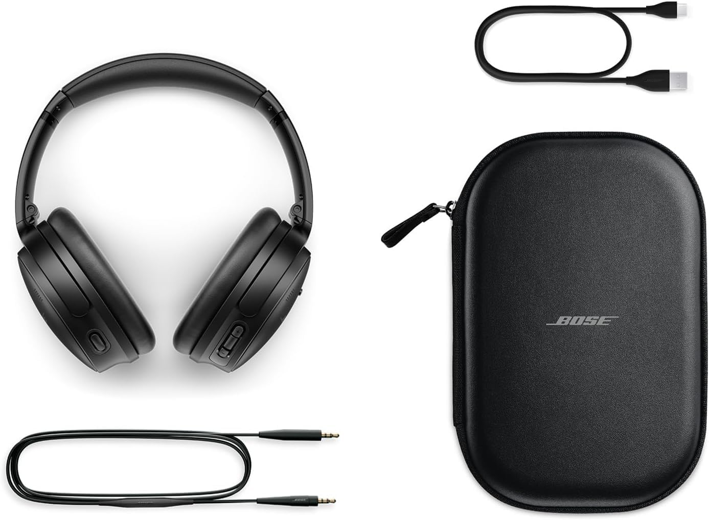 Bose QuietComfort headphones with included accessories: USB-C charging cable, 3.5mm audio cable, and carrying case