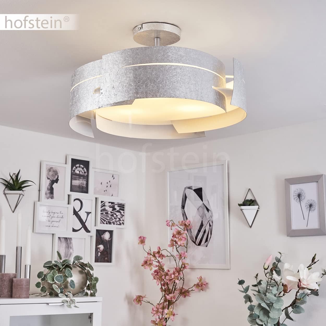 HOFSTEIN Novara Round Ceiling Light installed and illuminated in a living space