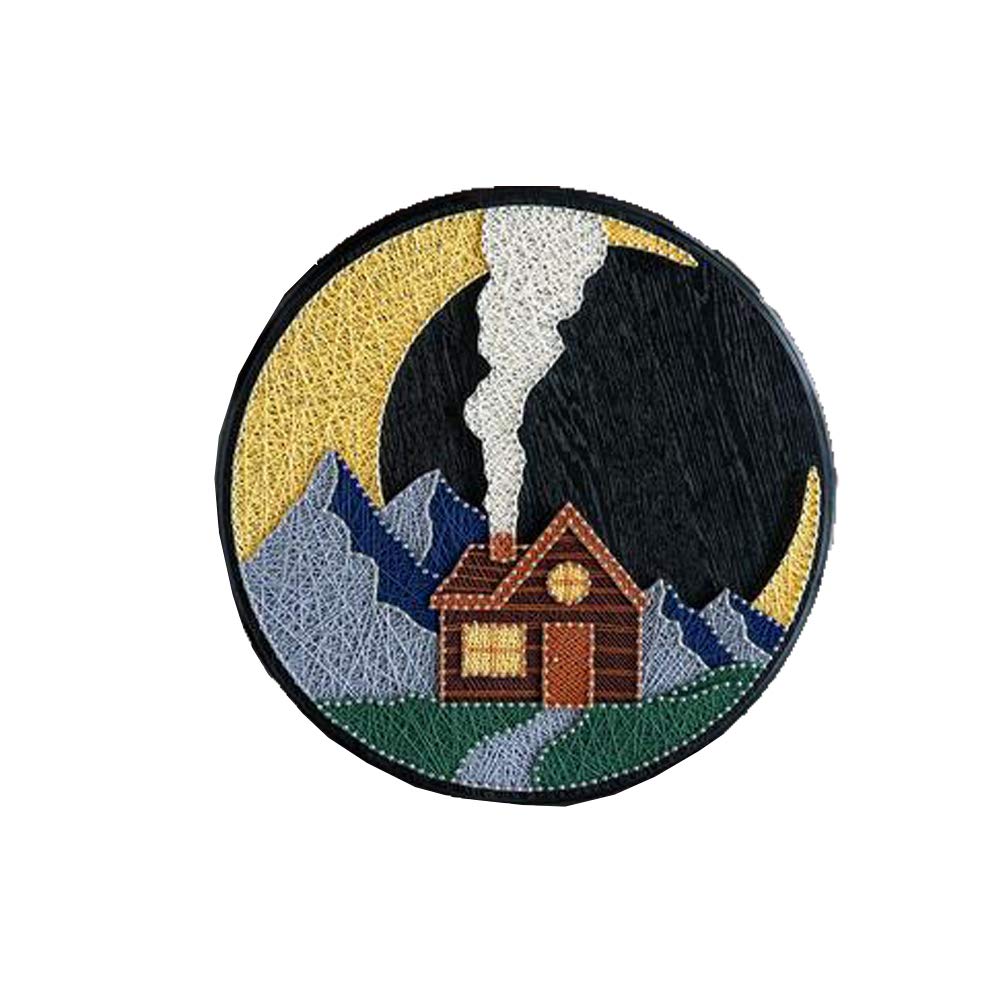 Tableau en fil tendu cabane forestière pour une soirée DIY cocooning