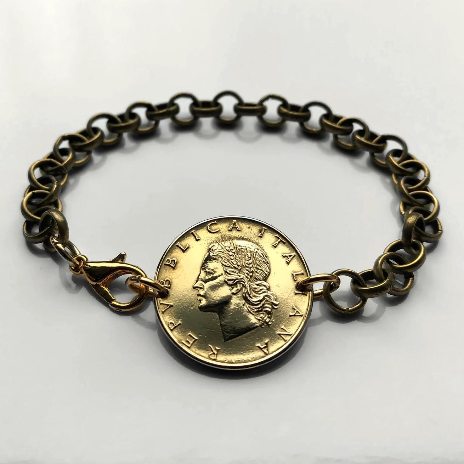 1958 Italy 20 Lire coin rolo link bracelet Italian lady Minerva Roma Florence Venice Milan Napoli Verona Torino Genoa Bologna Siena Ancona Palermo Cagliari Bergamo Lecce Modena Tuscany Parma b000087