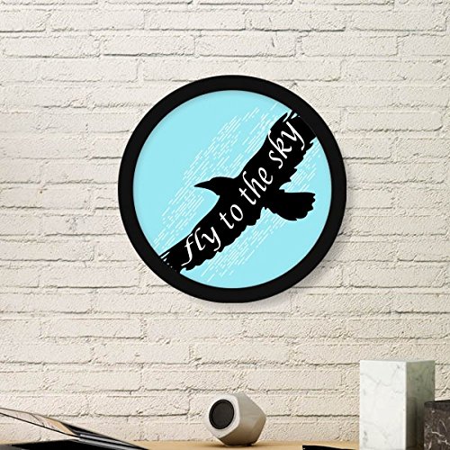 Cadre photo ronde en bois d'aigle noir pour creer un salon style decoration nature sauvage