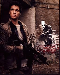 Posterazzi Drew Roy Holding Gun With Alien Graffiti In Falling Skies Photo Print (8 x 10) - Item # MVM50099