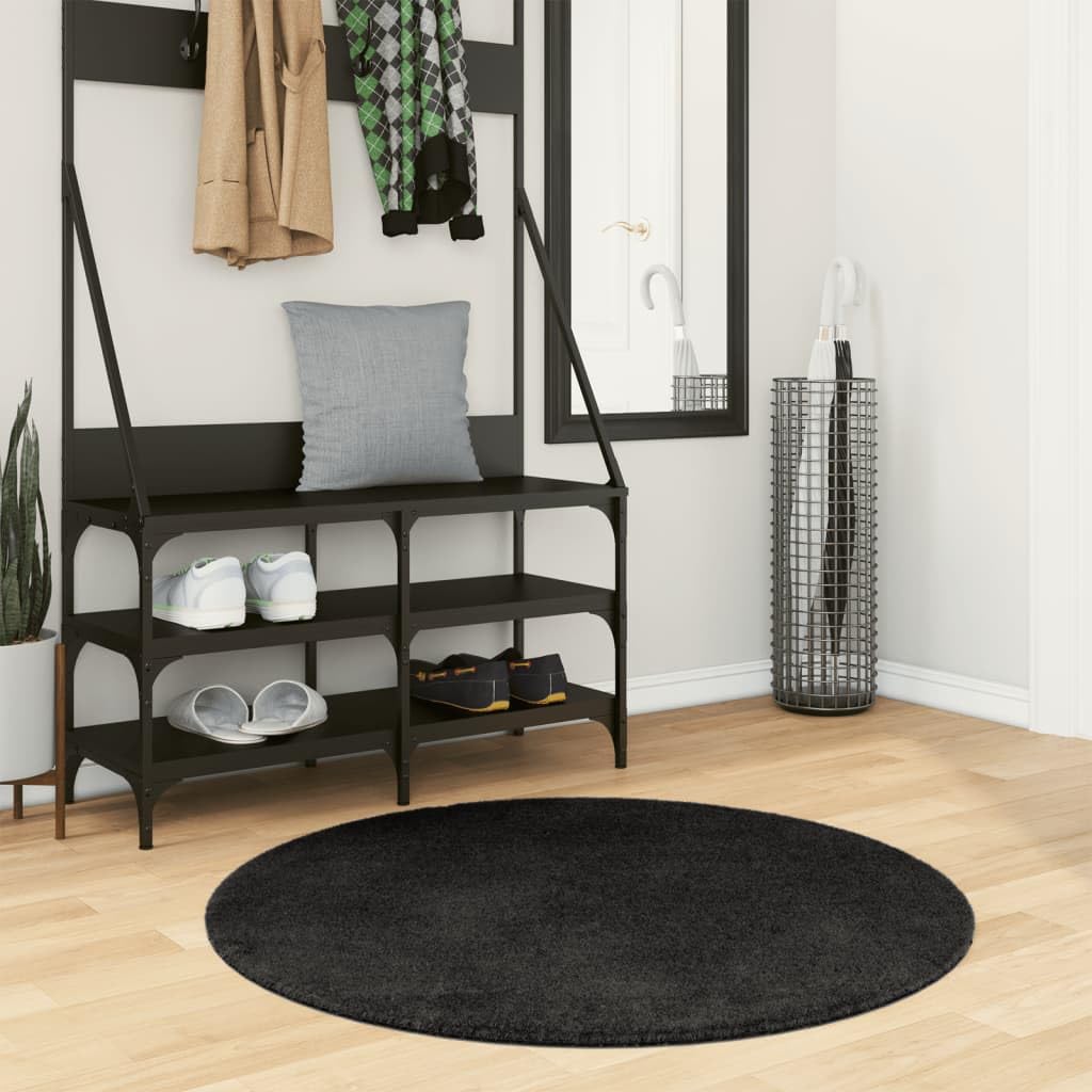 Tapis noir rond Ø 100 cm lavable et antidérapant pour un salon moderne