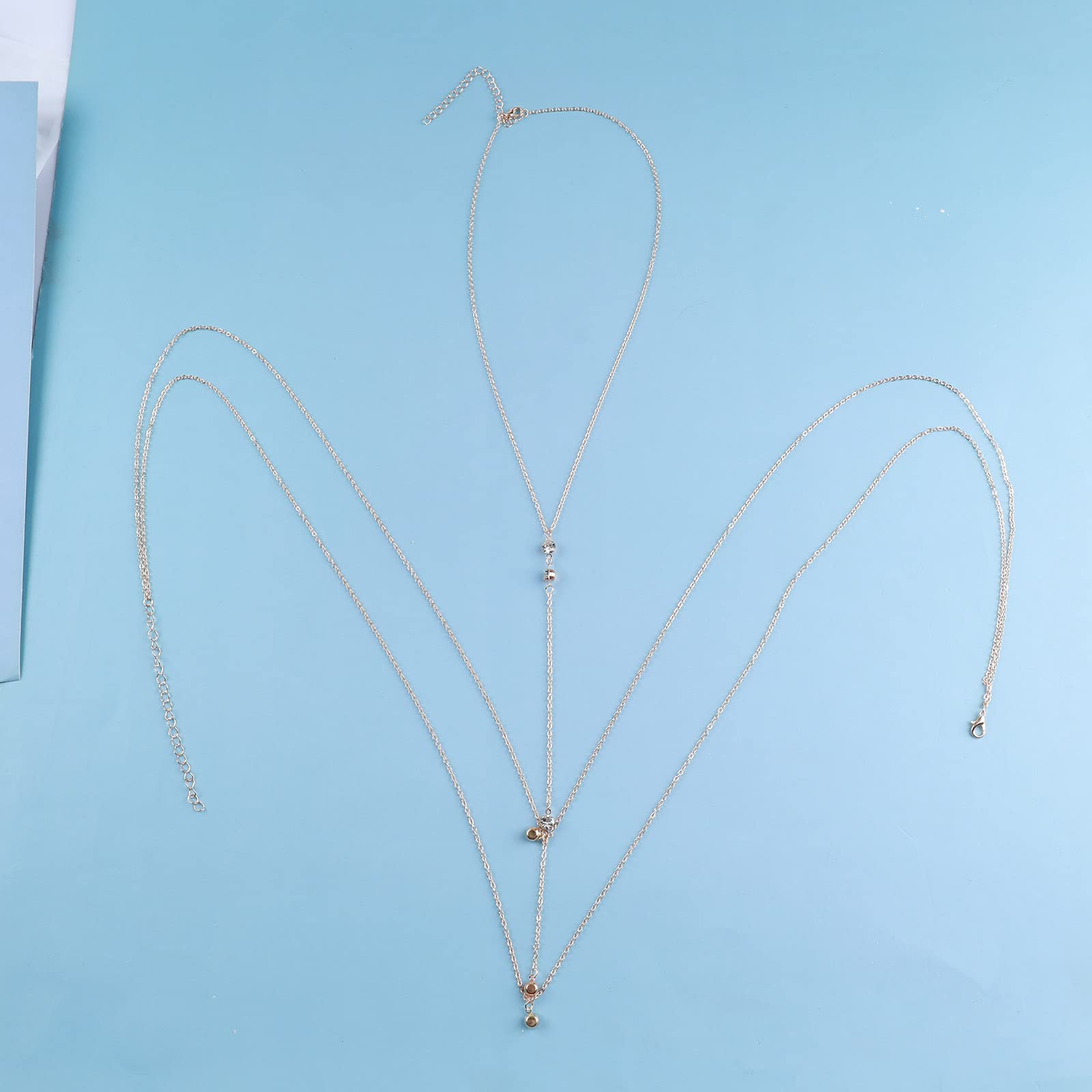 Wendalern Chaîne de corps en strass pour femmes Collier de corps en cristal superposé Chaîne de soutien-gorge de plage sexy pour bikini Chaîne de ceinture à glands pour le ventre Bijoux de corps