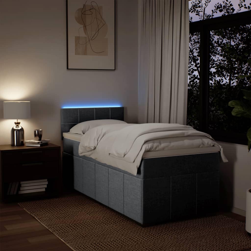 Łóżko kontynentalne 90 x 200 cm, jasnoszare z materacem ze sprężynami kieszeniowymi, miękkim obiciem z materiału, komfortowym topperem i oświetleniem LED do sypialni