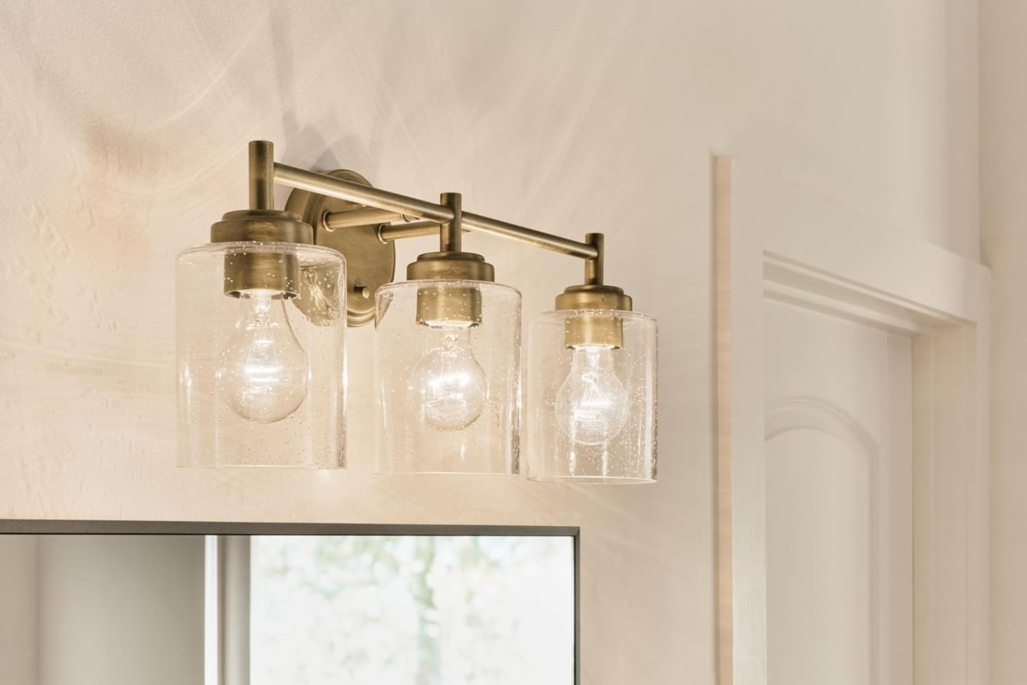 Kichler Winslow 21.5" 3-Light Bathroom Vanity Light Fixture with Clear Seeded Glass in Natural Brass for Luxe Industrial Style Over Mirror (21.5" x 9.25"), 45886NBR