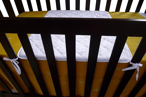 crib spit up pad