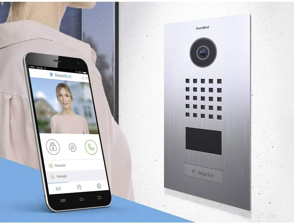 DoorBird D2101V with smartphone displaying the DoorBird app interface