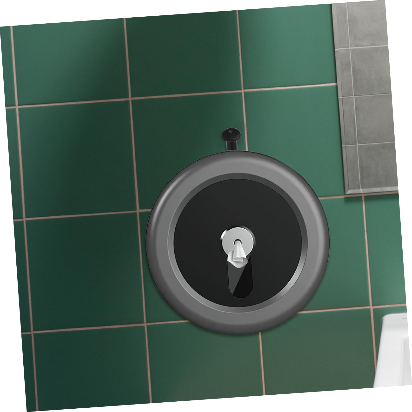 Using key with round toilet paper dispenser